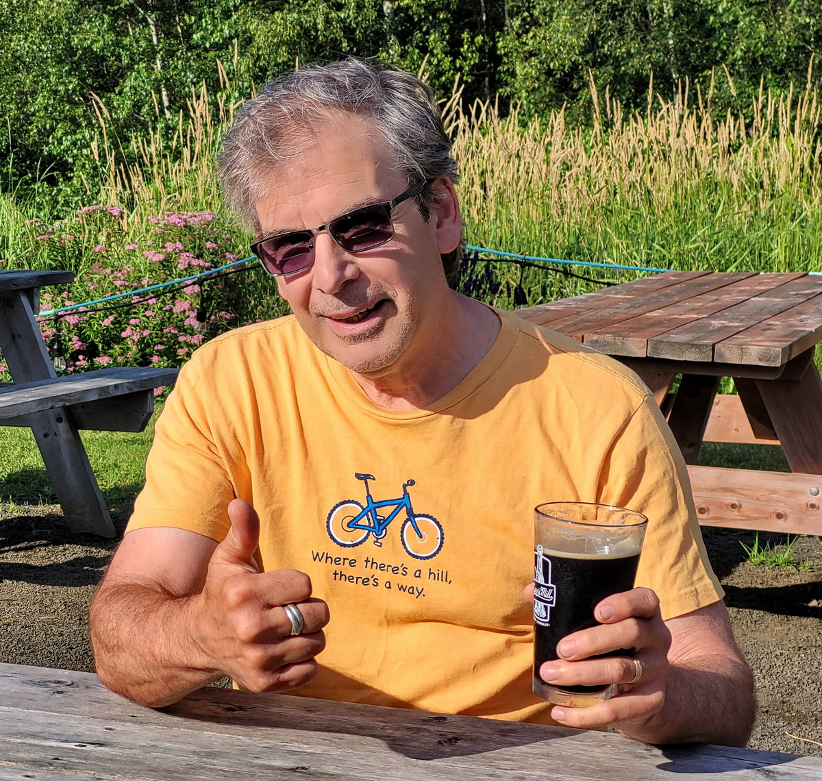 Dan thumbs up with a stout beer at Lunn's Mill Brewery Dan with a beer